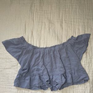 It’s a light blue off the shoulders top